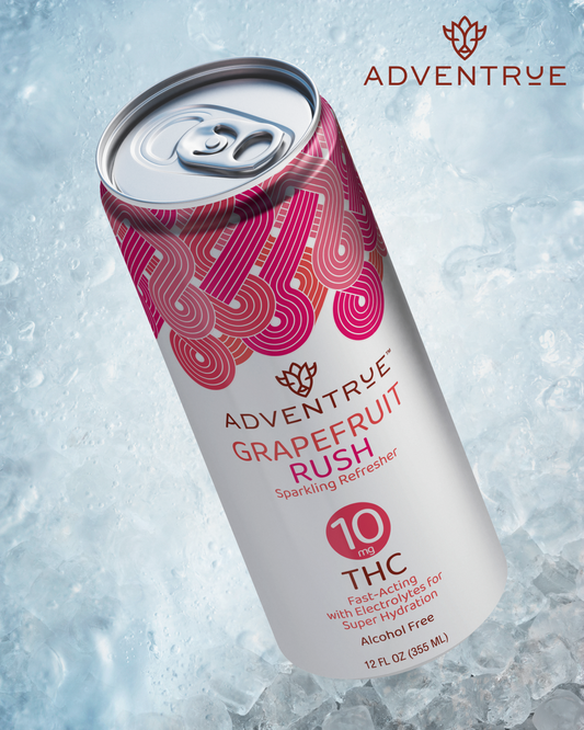 Adventrue Grapefruit Rush sparkling refresher can on ice with 'Adventrue' branding